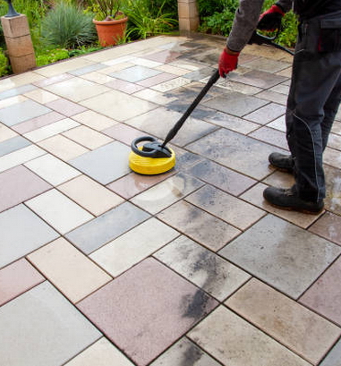 Person worker cleaning the outdoors floor. Person worker cleaning the outdoors floor.