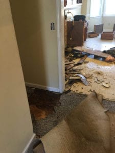 What Does Water Damage Do to Your Home? | WCC 1 Brushes, rubber gloves, and cleaning supplies to clean a home for the holidays